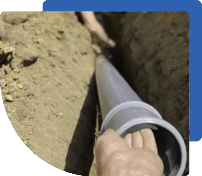 Close-up of a sewer line being serviced indoors