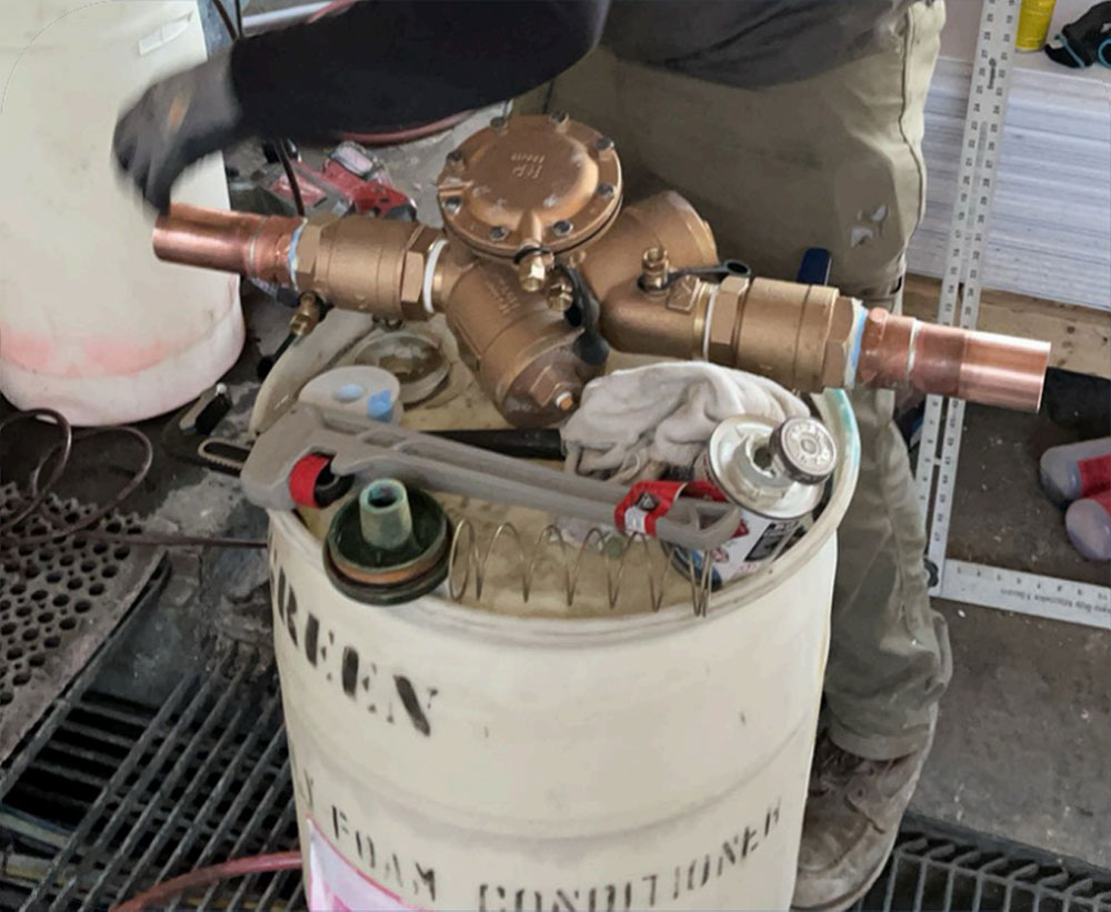 Plumbing valve installation on pipe.