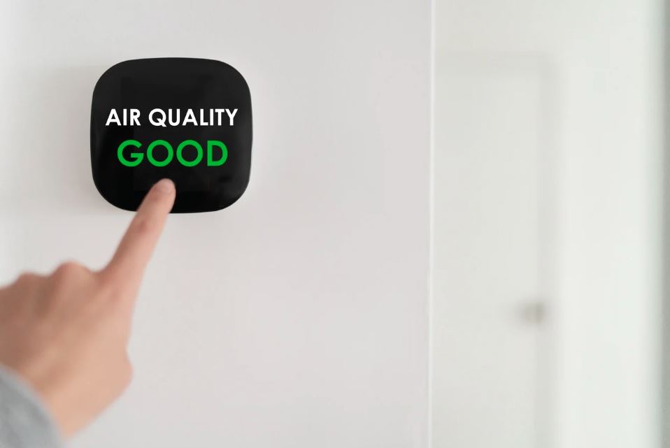 ndoor air quality monitor showing good air quality level.